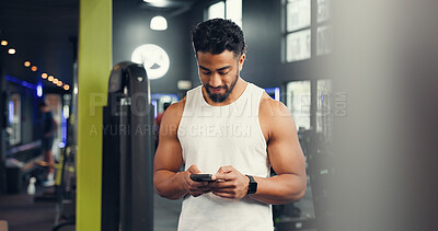 Buy stock photo Texting, athlete and man with smartphone, gym and communication with contact on social media or web. Fitness, chat and person with mobile on break, online and typing message with tech in health club