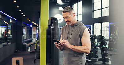 Buy stock photo Happy, man and chat with smartphone, gym and communication with contact on social media and athlete. Fitness, online and mature person with mobile on break, typing or message with tech in health club