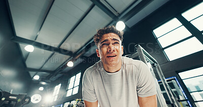 Buy stock photo Tired, exercise and man in gym, sweating and wellness with fatigue, workout and challenge. Endurance, health center and person with fitness, break and exhausted with lens flare, rest and training