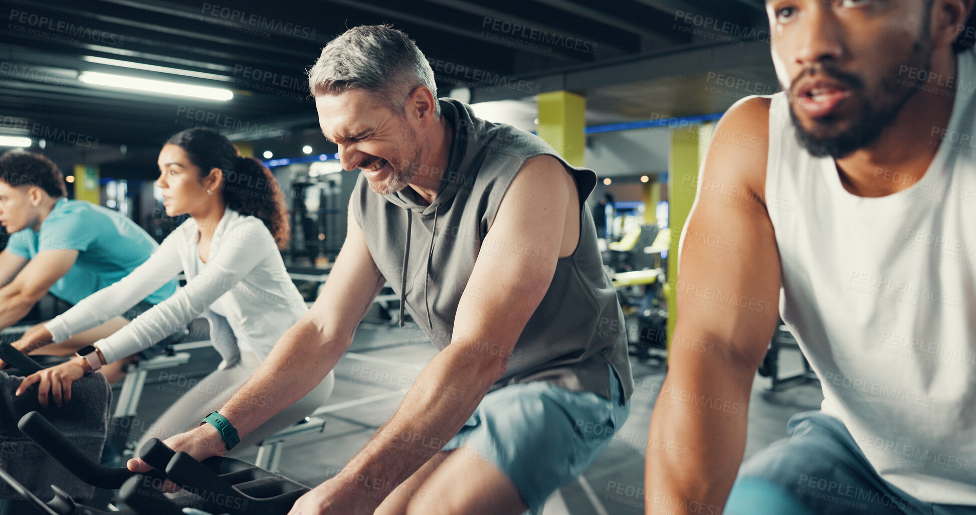 Buy stock photo Spin class, sweat and man in gym on bicycle for exercise, cardio workout and intense training. Sports, cycling and people with strain on stationary bike for endurance challenge, health and wellness