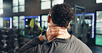 Man, neck pain and back with injury in gym for muscle tension, stress or overworked exercise. Male person, accident or strain with sore spine, bruise or joint inflammation for pressure in health club