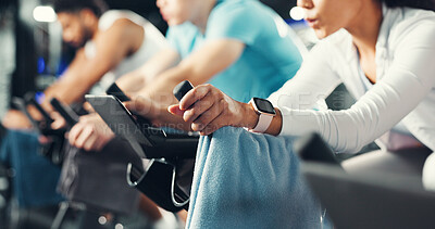 Buy stock photo Fitness, spin class and hands of people in gym on bicycle for cardio exercise, workout and training. Sports machine, health club and group on bike for cycling, endurance and challenge for wellness