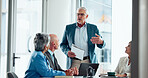 Businessman, meeting and discussion with team for presentation or corporate strategy in office. Man, speaker and talking with employees for group project, ideas or company proposal in workplace