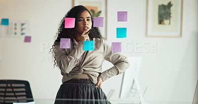 Business woman, thinking and schedule planning with glass board in office for brainstorming ideas. Thoughtful, female person or creative employee contemplating with sticky note for project or tasks