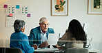 Business, people and meeting in office with paperwork, performance review and financial feedback. Mature CEO, employees and tech in workplace with document, task delegation and plan for development