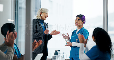 Buy stock photo Happy people, medical team and applause with award in meeting for congratulations or achievement. Group, employees or healthcare workers clapping with nurse, reward or trophy for work nomination