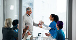 Award, doctors and trophy with people in meeting for healthcare breakthrough, research grant and prize. Medical milestone, applause and support with nurses in hospital boardroom for presentation