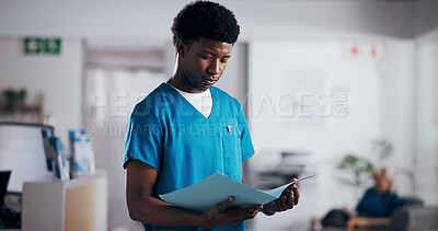 Buy stock photo File, medical and reading with nurse man in clinic for health insurance, records or update. Folder, healthcare and information with medicine professional in hospital for internship or residency