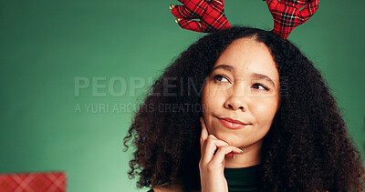 Buy stock photo Christmas, thinking and planning with woman in studio for decision, holiday season and gift idea. Festive tradition, reflection and mockup space with person on green background for inspiration