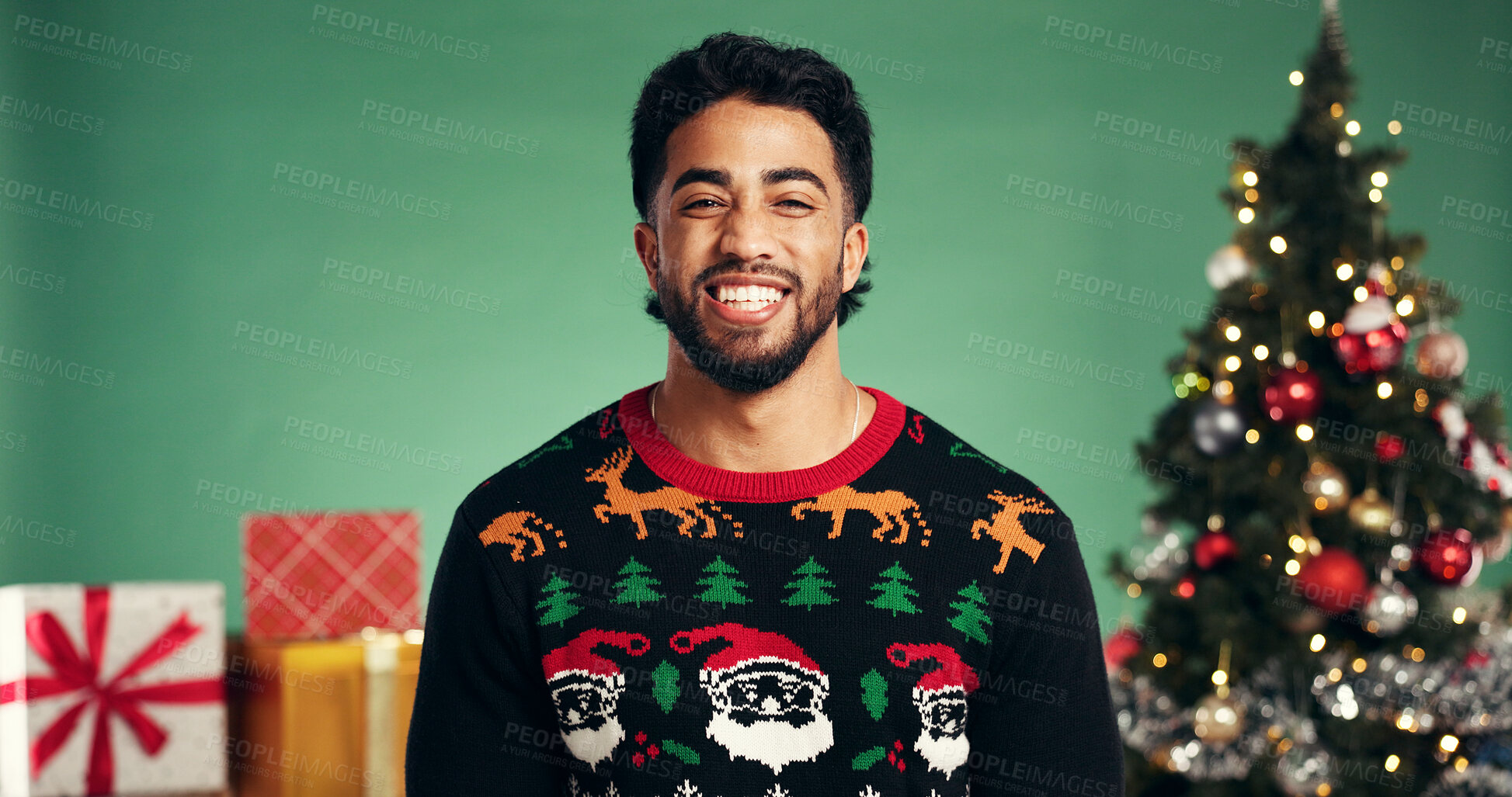 Buy stock photo Studio, man and excited for Christmas, portrait or festive celebration with decorations or presents. Happy, person and green background for Xmas season, December and tree with ornaments on holiday