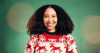 Buy stock photo Portrait, woman and smile in studio for Christmas season, celebration and festive tradition. Happy, African person and bokeh with xmas jersey, satisfaction and december holiday on green background