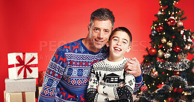 Buy stock photo Christmas, hug and portrait with family in studio together for bonding and gift or present. Smile, celebration and love with mature father and son on red background for festive tradition or holiday