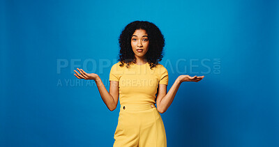 Buy stock photo Compare, portrait and shrug with woman in studio for balance, choice of weight or decision. Confused, mockup and open hands with African person isolated on blue background for options or selection