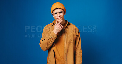 Buy stock photo Man, portrait and student thinking in studio for exam question, problem solving or academic future by space. Mockup, confused or male person with solution for college decision on blue background