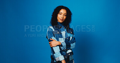 Buy stock photo Fashion, serious and portrait of woman in studio for designer, entrepreneur and about us. Confidence, pride and personal stylist with person on blue background for clothes tailor and mockup space