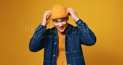 Buy stock photo Happy, fashion and portrait of man on yellow background for trendy style, winter clothes or confidence. Mockup space, outfit and person with positive attitude, smile and pride for aesthetic in studio