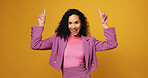 Portrait, woman and pointing with smile in studio of advertising, announcement and launch. Excited, female person and direction for information, promotion offer and show giveaway on yellow background