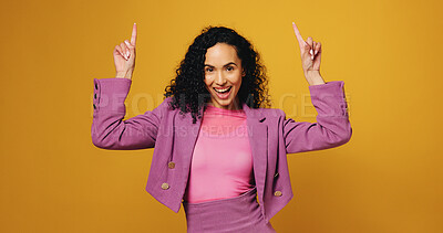 Buy stock photo Portrait, woman and pointing with smile in studio of advertising, announcement and launch. Excited, female person and direction for information, promotion offer and show giveaway on yellow background
