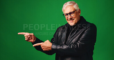 Buy stock photo Happy, man and point with portrait in studio for advertising, announcement and launch. Excited, mature person and hand gesture for information, promotion offer and giveaway guide on green background
