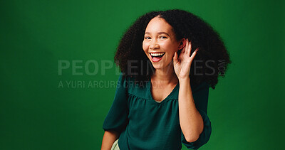 Buy stock photo Portrait, listening and woman in studio, ear and announcement on green background. Space, funny and person with happiness, gesture and rumor with smile, story and news with gossip, secret and hearing