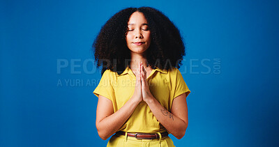 Buy stock photo Hands, praying and woman in studio for religion, worship and praise for belief, faith and spiritual. Mockup space, calm and person with prayer gesture for hope, trust and peace on blue background