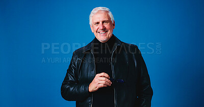 Buy stock photo Portrait, smile and man in studio, fashion and sunglasses with confidence on blue background. Pensioner, space and mature person with shades, stylish clothes and leather jacket with pride and eyewear