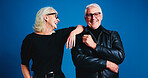 Senior couple, fashion and smile in studio for love, laugh support on blue background. Man, woman and stylish clothes in retirement with confidence, funny and cool glasses with portrait together