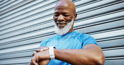 Buy stock photo Smart watch, runner and mature man in city for tracking exercise, training and workout progress. Sports, happy and African person on digital tech for wellness app, performance and outdoor for running