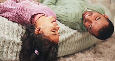Buy stock photo Happy, child and relax with father at house for love, playful fun and bonding together in bedroom. Smile, girl and lying and man on poof for rest, calm morning and family connection of cozy weekend