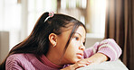 Home, thinking and girl with depression, kid and sad with anxiety, mental health and foster care trauma. Apartment, adoption and child on couch, emotion and stress with mistake, reflection or abandon