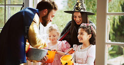 Buy stock photo Children, happy or sweets at door on halloween for tradition, celebration and trick or treat. Festival, people or neighborhood kids with bucket at house for candy collection, snack or fantasy costume