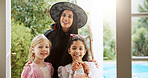 Halloween, portrait and mother with girls, smile and bonding together with support, party and love. Family home, mama and daughters with costume, happiness and children with tradition and celebration