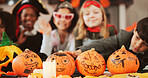 Kids, halloween and group with pumpkin, decoration and creativity with drawing at costume party in home. People, children and vegetables for lantern, art and celebration for festive event at house