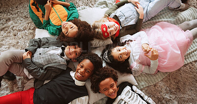 Buy stock photo Halloween, above and kids on floor, portrait and relax with celebration, event and bonding together. Home, friends and children on carpet, smile and costume party with holiday and spooky season