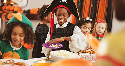 Buy stock photo Halloween party, snack and kids with boy, celebration and candy with happiness. Friends, home and children with food, costume and sweets with treat, tradition and fantasy with popcorn and holiday