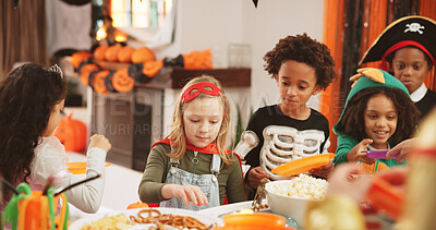 Buy stock photo Halloween party, food and kids with celebration, home and hungry with social gathering. Friends, apartment and children with snack, costume or sweets with treat, spooky season or tradition with event