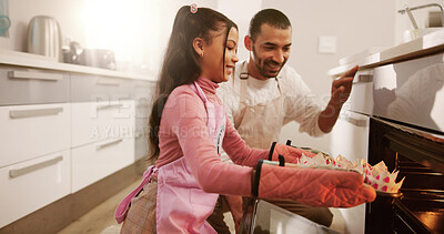 Buy stock photo Baking, father and girl in kitchen, oven and bonding together with parent, learning and recipe. Home, happy family and dad with daughter, helping and teaching with skills, cooking and safety