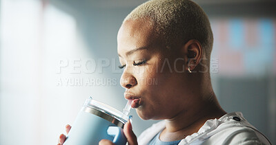 Buy stock photo Drinking, water and woman on break, gym and cool down after workout, wellness and hydration of body. Calm, athlete and African person with liquid for dehydration prevention, fitness and health club