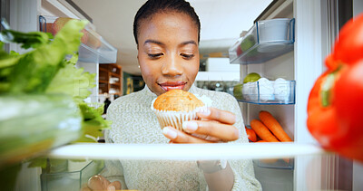 Buy stock photo Kitchen, fridge and black woman with muffin, pov and home with nutrition, hungry and option. African person, apartment and refrigerator with dessert decision, sweet craving and healthy diet break