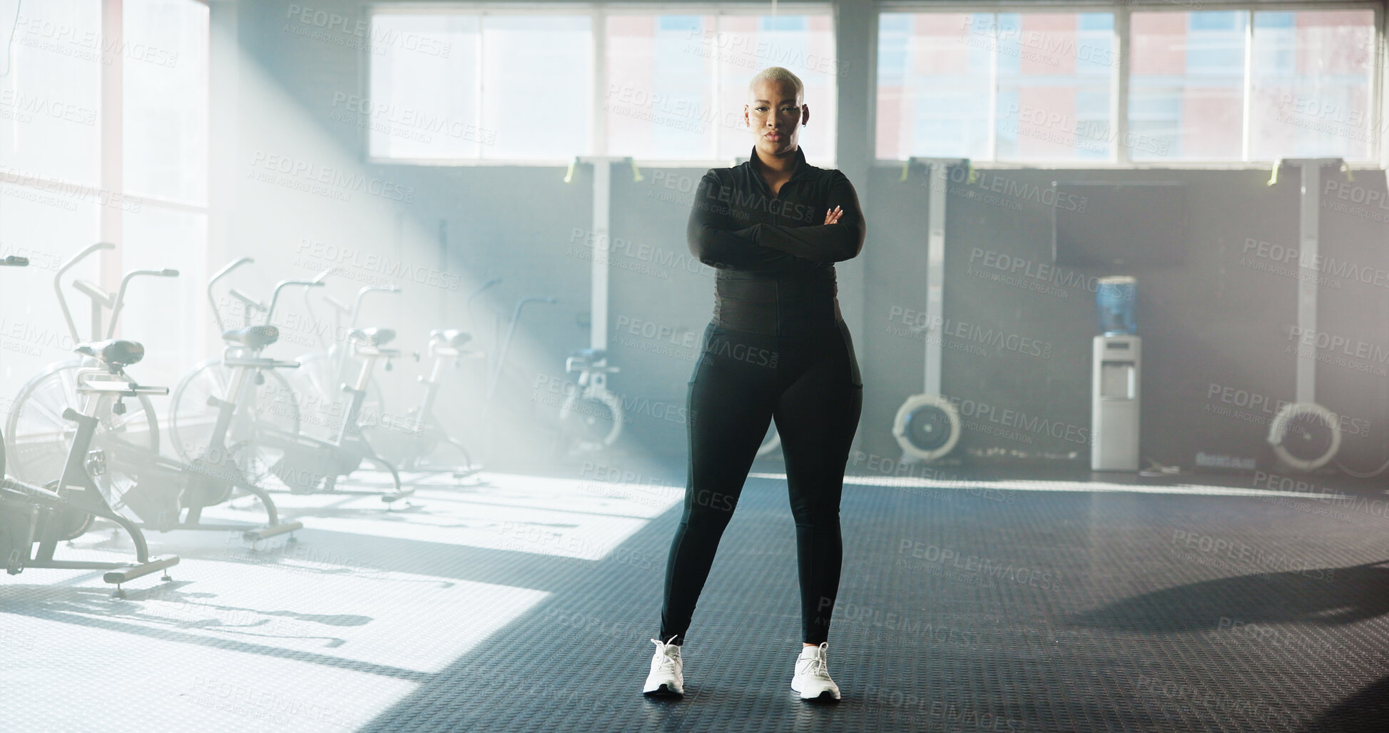 Buy stock photo Portrait, athlete and black woman with arms crossed at gym for fitness, training and personal trainer. Confident, female person and coach with workout tips, sports membership and exercise instructor