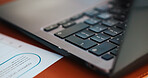 Business, keyboard and laptop on desk in office for company sale, information or report. Documents, internet and research with computer closeup in empty workplace for online networking or planning