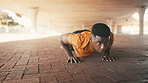 Athlete, black man and pushup outdoor for fitness, exercise and strength training. Male person, weightlifting and floor for sports workout, resilience performance and body balance for power challenge