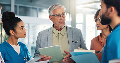 Buy stock photo Man, doctors and team with tablet, discussion and planning for healthcare services at hospital. Medical director, group and talk with tech, documents or application with advice for report at clinic
