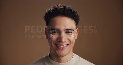 Buy stock photo Face cream, skincare and portrait of man in studio for beauty, natural or facial glow. Cosmetic, moisturizer and male person from Canada with lotion for dermatology routine by brown background.