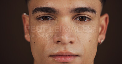 Buy stock photo Skincare, beauty and portrait of man in studio with natural, cosmetic and facial glow for confidence. Health, wellness and face of male person from Australia with dermatology by brown background.