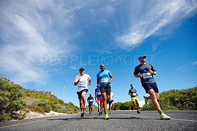 Buy stock photo People, competition training and outdoor marathon for fitness, cardio challenge and road for endurance. Athletes, contest and low angle for workout in nature, international tournament and sports race