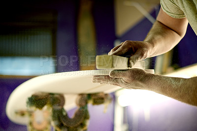 Buy stock photo Surfboard, hands and sanding in workshop for manufacturing, design or polish. Surf, person and tools to shape blank with block, smooth and production process with dust on foam for creative handcraft