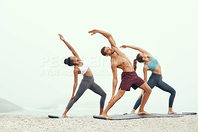 Buy stock photo Men, woman and yoga on beach with stretching balance or mindfulness with chakra, wellness or friends. People, arms and morning mist at ocean or pilates warm up for calm self care, exercise or group