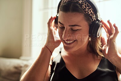 Buy stock photo Relax, music and woman with headphones, smile and chilling with radio, streaming and comfortable. Home, sound and calm on couch, listening and person in living room, podcast and rest in apartment