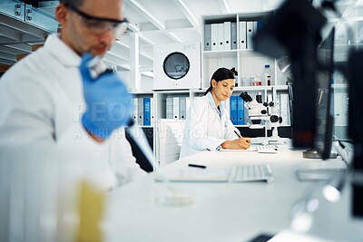 Buy stock photo Scientist, woman and writing notes for research, test and chemical analysis for health innovation in lab on microscope. Dropper, science and medical study of drugs, liquid and exam for biotechnology